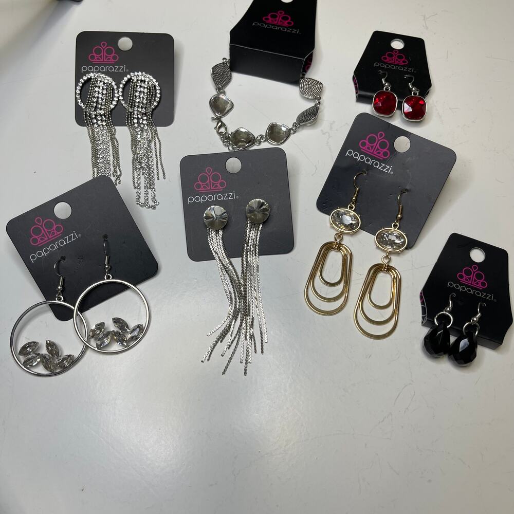 Seven pairs of pierced earrings silver tone red rhinestones black bling